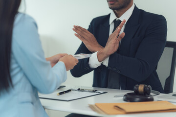 Refusing Bribery:  A close-up shot of a lawyer refusing a bribe, emphasizing ethical conduct,...