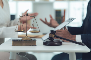 Legal Consultation:  Scales of Justice and Gavel on Table