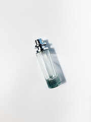 A glass perfume bottle on isolated white background