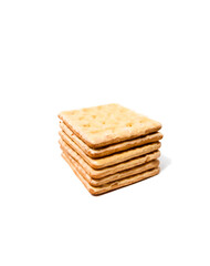 Stack of crispy cracker with a sprinkle of sugar and the other side with full of cheese coating. The taste is sweet. Isolated on a white background