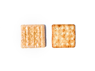 Crispy cracker with a sprinkle of sugar and the other side with full of cheese coating. The taste is sweet. Isolated on a white background