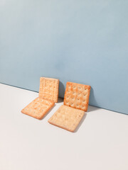 Crispy cracker with a sprinkle of sugar and the other side with full of cheese coating. The taste is sweet. Isolated on a white background