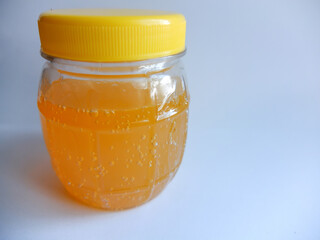 Studio shot of an honey jar with isolated on white background