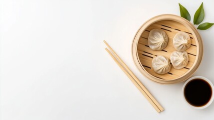 Modern bamboo steam basket with dumplings in top view.