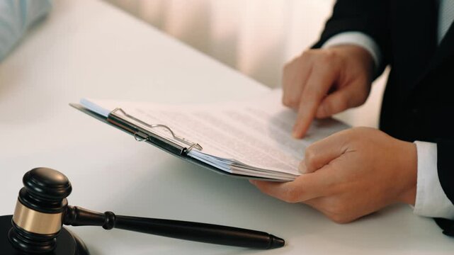 Client rely on law firm to provide legal counsel and advice with lawyers or attorney review, analyze complex legal contract document as trusted corporate law consultation service. Slow motion. Rigid.