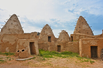 Clay houses with pointed roofs in Sarai Batu settlement