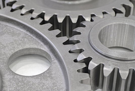 Three steel gearwheels, part of gear transmission