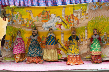 Picture of puppets arranged in series in Jaipur, Rajasthan. tradition, culture love stories history mythology colorful pretty rajput magic belief art artist obsolete economy poor fort fair village