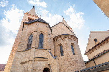 Fototapeta premium Towers of the St Georges Basilica in Third courtyard of Prague Castle near St Vitus Cathedral in Prague in Czech Republic
