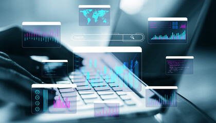 Digital graphs and data visualizations overlaying a person typing on a laptop in a modern technology-driven environment.