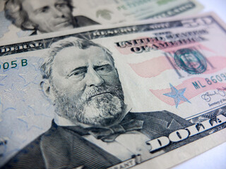 Close-up cash, 100 hundred dollar bills, 50 dollar bills, 20 dollar bills