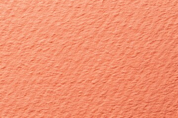 Fototapeta premium Rough grain paper texture with pastel coral background