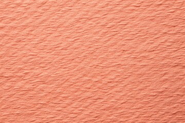 Fototapeta premium Rough grain paper texture with pastel coral background