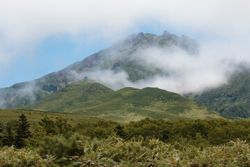 Green summer mountain landscape with white clouds, Rishiri, Hokkaido, Japan