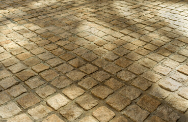 Yellow paving stones on sunny day, background