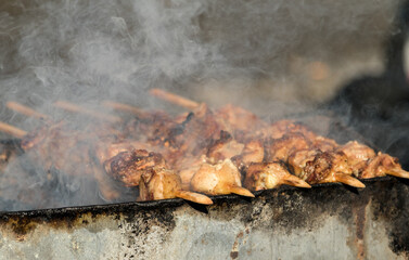 skewers of meat prepares outdoors