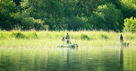 fishermen catch fish with a rubber boat