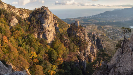 Mountain panoramic landscape with valley, rocks and blue cloudy sky