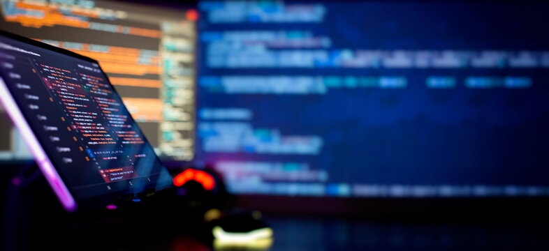 Programming code abstract screen of software developer. Coding script text on screen.