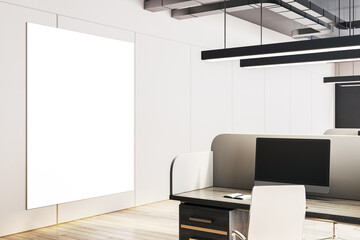 Modern office interior with cubicles, white walls, and a large blank vertical display for advertising or promotion. 3D Rendering