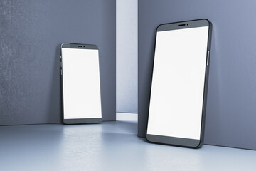 Two modern smartphones with blank screens leaning against a wall. Digital device mockup concept. Minimalistic design. 3D Rendering