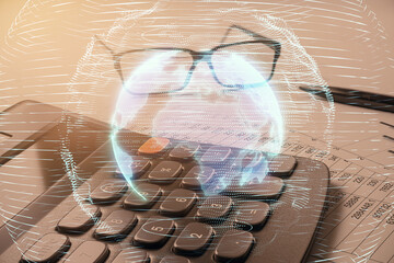 Holographic globe overlaying a calculator and financial spreadsheets, symbolizing global business and accounting technology.