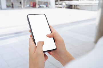 Hand holding smartphone mockup of blank screen, Take your screen to put on advertising.