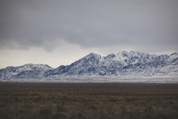 Snowy peaks horizontal desert view