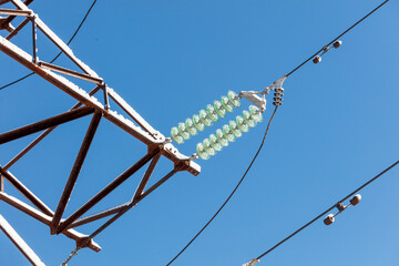 A power line with a green and white insulator