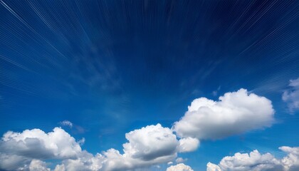 明るい青空に白い雲がふわふわと浮かぶ、軽やかで開放感のある風景が広がる背景。

