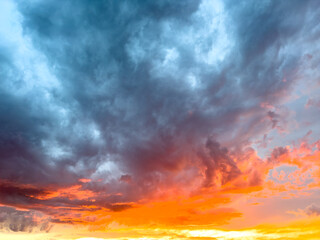 A beautiful sunset with a blue sky and orange clouds