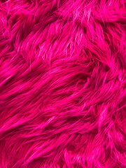A close up of a pink fuzzy animal fur