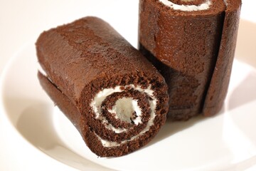 chocolate rolls on a white plate
