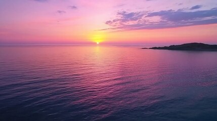 Fototapeta premium Serene Sunset Over Calm Waters: A Palette of Pink and Orange Skies