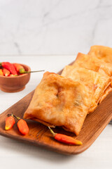 Martabak Tahu or Tofu Spring Rolls. Is traditional snacks in Indonesia.perfect for recipe, article, catalogue, or any commercial purposes. with copy space.