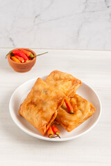 Martabak Tahu or Tofu Spring Rolls. Is traditional snacks in Indonesia.perfect for recipe, article, catalogue, or any commercial purposes. with copy space.