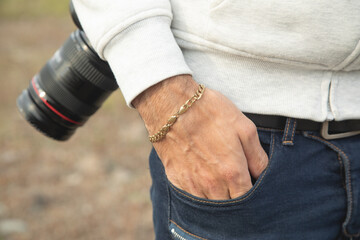 Male hand with a expensive bracelet. Fashion accessories and jewelry