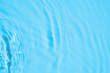 Abstract transparent water shadow surface texture natural ripple on blue background