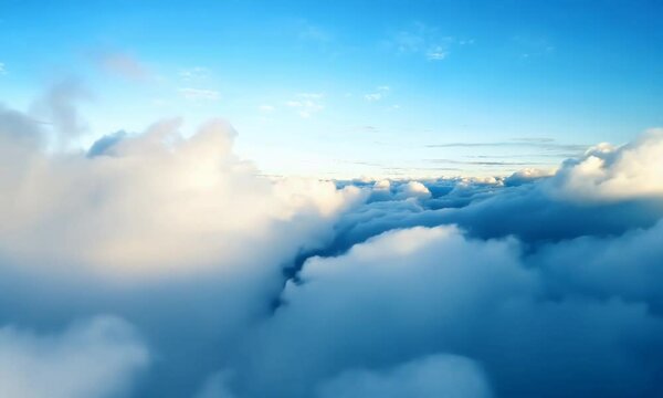 4K aerial footage of flying through the sky with sunlight streaming through fluffy clouds at sunrise, creating a serene and beautiful landscape. Perfect for showcasing travel, freedom, and sky views.