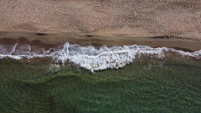 Sardinian sea waves crashing on the beach of Portixeddu in Buggerru