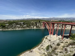 The Maslenica Bridge, a deck arch bridge carrying the D8 state road spanning Novsko Zdrilo strait (Croatia) - Stari Maslenički most, lučni čelični most preko Novskog ždrila na Jadranskoj magistrali
