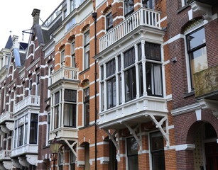 Fototapeta premium Amsterdam Van Eeghenlaan Brick House Facades with Bay Windows Close Up, Netherlands