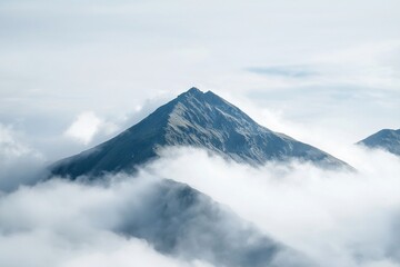 Majestic Mountain Peak Emerging from the Clouds