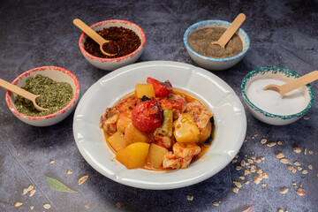 Traditional delicious Turkish dishes; potato, tomato, pepper, garlic and meat dish (Turkish name; Fırında tas kebabı,)