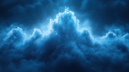 Dramatic blue night sky with glowing clouds.