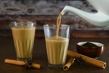 Serving Indian tea in a glass cup.