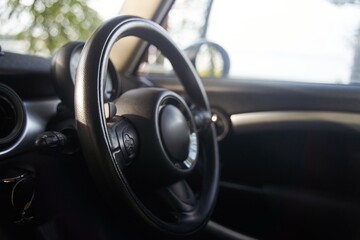 The steering wheel in the car. Torpedo in the car. High-quality photo