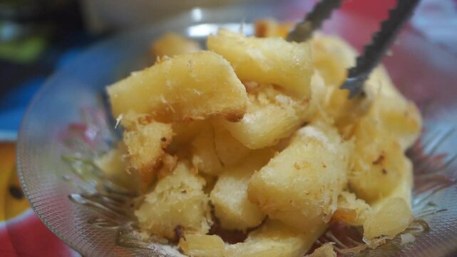 Fresh fried cassava that has been cooked on a white plate