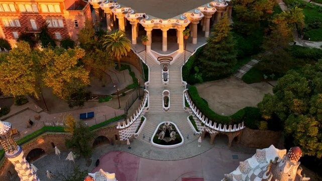 Aerial drone view of Park Guell at sunrise in Barcelona. Famous Antonio Gaudi architecture. Tourist spot in Barcelona, park Guell drone view