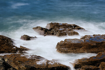 Rocks in the sea with waves